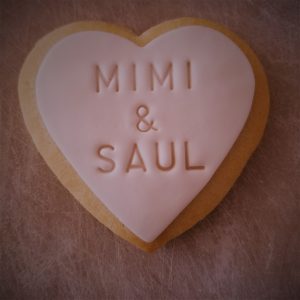 personalized stamp on a fondant covered sugar cookie